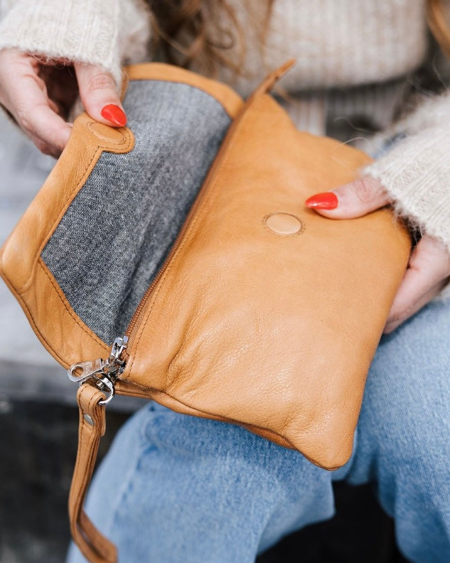 Tan leather clutch store bag